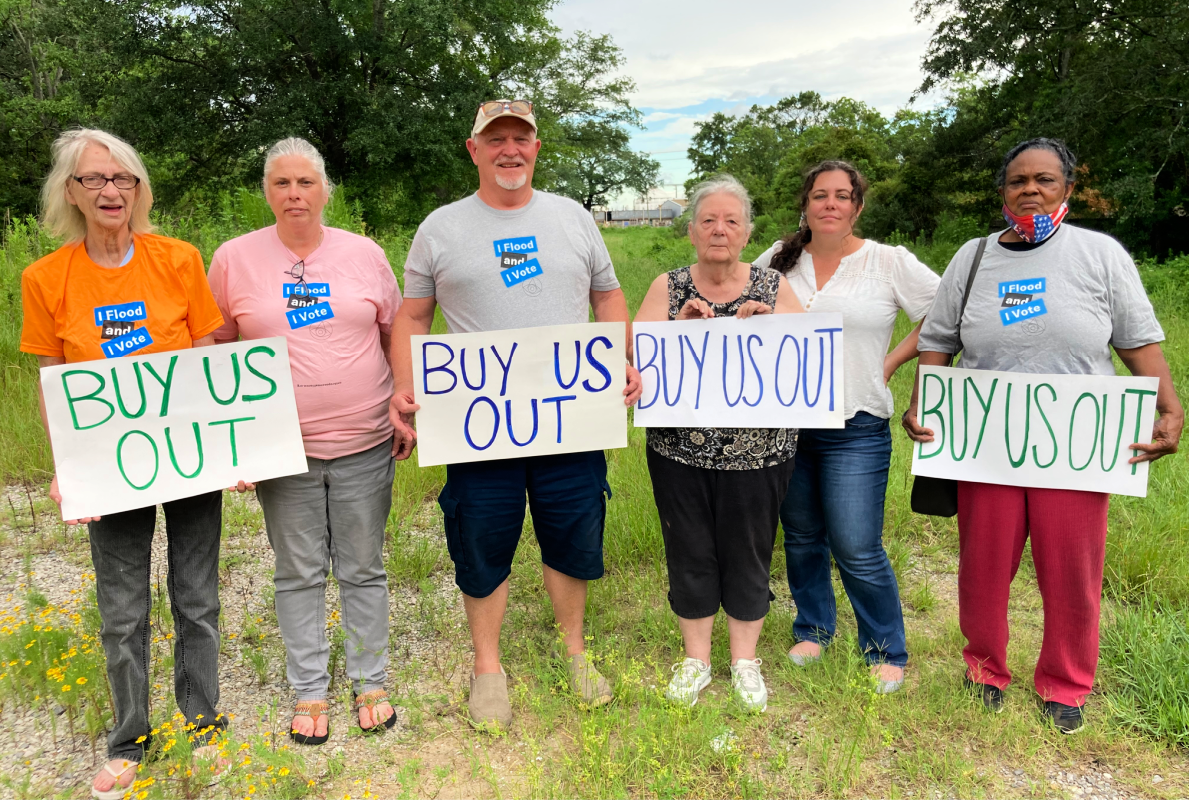 Cherokee Concerned Citizens_IMG_6561_800W Cherokee Concerned Citizens team holding signs saying Buy Us out.